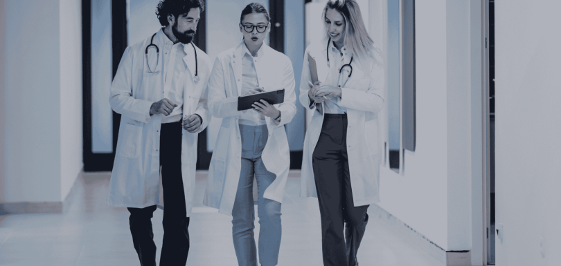 A group of physicians in a clinical setting, illustrating the strategic value of a Clinical Observership program from ARCAS Education.