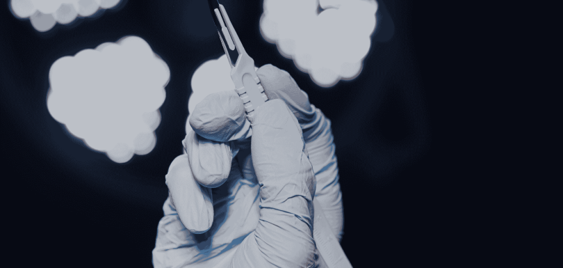 A surgeon gaining tactile experience in a hands-on fresh frozen cadaver course, the gold standard in advanced surgical training.